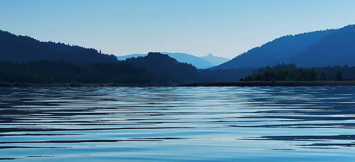 Nature and the mind, calm lake water reflecting on open sky
